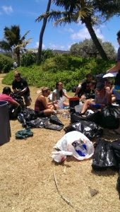 2013-07-13+11.53.44 People sitting with trash bags