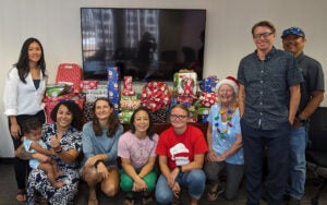 Tyler Hawaii Staff with gifts for adapted families