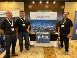 Tyler Hawaii booth at HDGS with our staff members