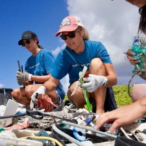 70732690_10156239199841104_4458927865798328320_o Women holding marine debris