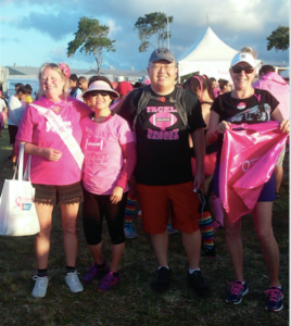 bc Three women and a man smiling wearing pink
