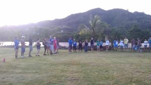 group of people holding hands in a circle