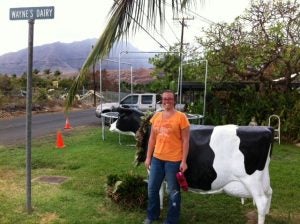 image woman posing in front of plastic cow