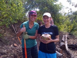 img-20121020-00024 2 women posing, one holding a coconut