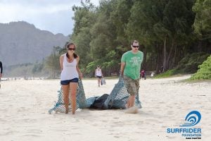 img0553-l man and woman on beach pulling a net