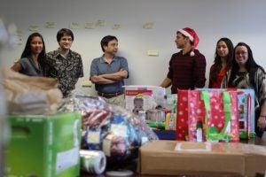 group of people and wrapped gifts