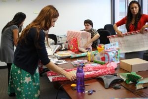 woman wrapping gifts