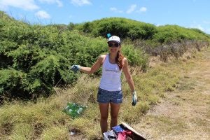 img_0302 Woman holding up bag of beer bottles