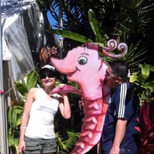 shrimp Man and woman in front of shrimp picture